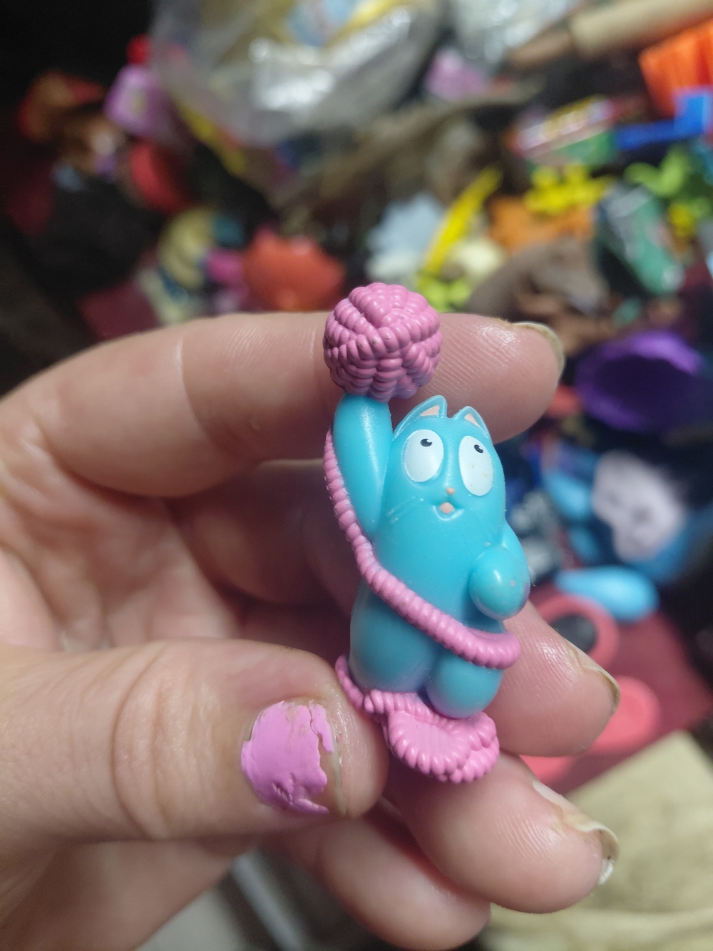 blue mini cat figurine holding a pink ball of yarn from the Hasbro Lost Kitties